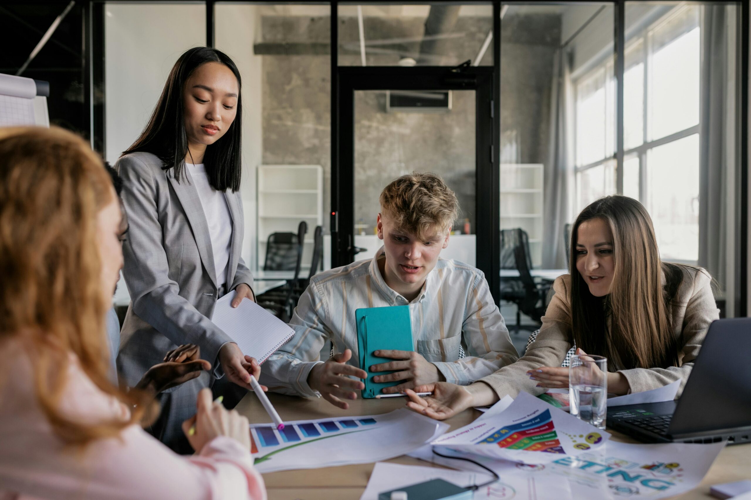 A group of people in the middle of a meeting.